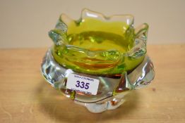 A Czech clear-cased green and amber art glass vase or ashtray