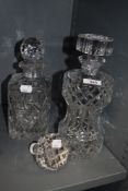 Two cut-glass decanters, one of waisted cylindrical form, the other of traditional canted square