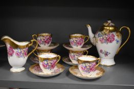 A 19th/20th Century English porcelain tea service, decorated with a hand painted foliate design