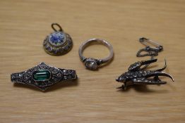 A small assortment of jewellery, comprising a miniature mosaic floral pendant, an Art Deco style