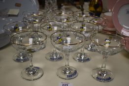 Twelve 1970s Babycham branded coupe glasses, each measuring 12cm high