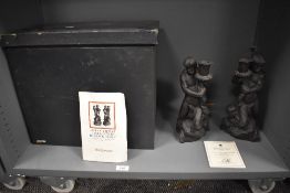 A pair of Wedgwood black basalt Triton candlesticks, number 191 of 200 with certificate, each