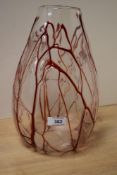 A 20th Century studio glass vase of ovoid form, with trailed red drip design, measuring 31cm high