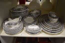 A selection of Losol Ware transfer printed tableware including ashettes, dinner plates, and lidded