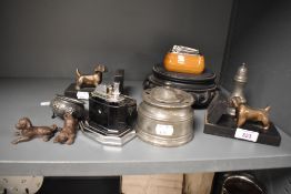 A Ronson 'Touch-Tip' table lighter, a Ronson table lighter with wooden base surround, a pair of