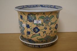 A 20th Century Chinese polychrome jardiniere and tray, decorated with a stylised foliate design