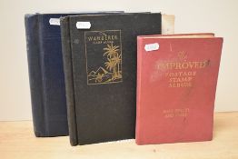 Three leather bound stamp albums, to include 'The Improved Postage Stamp Album' with stamps