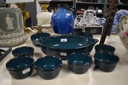 A 1930s Denby 'Danesby Ware' vase, of jug form and in an electric blue streaked glaze, measuring
