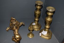 A late 19th/early 20th century cast-brass gas light bracket, of scrolling form and cast with rams,