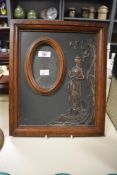 An early 20th Century photograph frame, decorated with a relief moulded Art Nouveau design,
