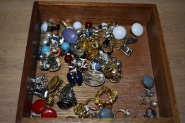 A selection of clip on earrings, including enamelled examples, paste set examples, hoops and some