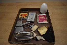 A 20th Century Ronson silver plated table lighter, with half gadrooned body and measuring 9cm