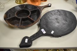 A primitive wooden compartmentalised spice tray and wooden bakers paddle, thought to be Indian.