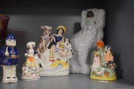 A Victorian Staffordshire flatback spaniel dog, measuring 28cm high, together with other