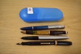 Four vintage fountain pens by Parker and Swan