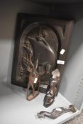 An unusual carved wooden panel, depicting a Viking long boat within an arched surround, marked P.