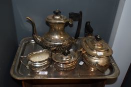 A silver plated four piece teaset, comprising a hot water pot, teapot, sugar and cream, each of