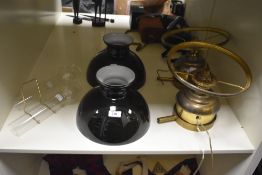 Two 19th Century brass oil lamps with black glass shades, each measuring 40cm high