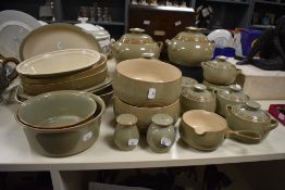 A large selection of Denby stoneware tableware, in the Camelot pattern, including lidded tureens,