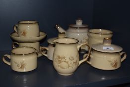 A Denby stoneware tea service, in the 'Memories' pattern and comprising teapot, two teacups and