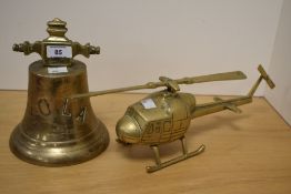 A 19th/20th Century brass ship's bell, engraved 'YOLA', measuring 21cm high, and a vintage brass
