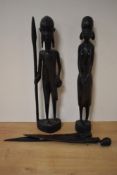 A pair of African tribal carved warrior studies, each measuring 36cm high, and a pair of hardwood