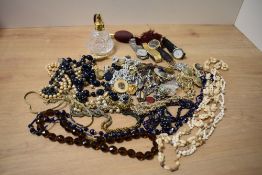 An assortment of costume jewellery, including wristwatches such as Seiko, beaded necklaces, clip