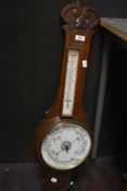 A late 19th Century mahogany cased aneroid barometer with detached thermometer, measuring 80cm long