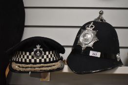 A Blackburn Police custodian helmet, and another