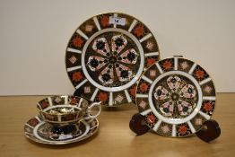 A Royal Crown Derby Old Imari patterned teacup and saucer, stamped to the underside, together with