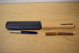 A boxed Parker Frontier rollerball pen in blue with lustraloy cap and a wooden cartridge fill