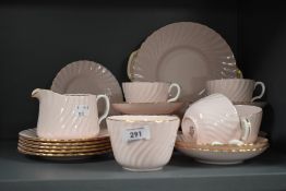 A mid-20th Century Minton porcelain tea set, in a shell pink swirl design and heightened with