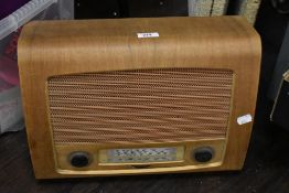 A mid-20th Century teak cased valve radio, plug and part cable removed for safety
