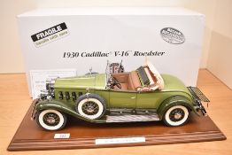 A Danbury Mint 1:12 scale Die-cast, 1930 Cadillac V-16 Roadster in original packaging, box and