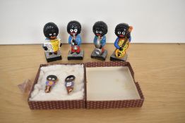 Four Robertson Advertising Figures, Band Members and a Pattorini and Gomm Frederick Golden Shred Pin