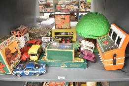 A shelf of mixed toys including Modern Die-casts, Alps Cocky Spaniel Mechanical Toy boxed, plastic