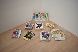 A collection of Trading Cards including 1976 Topps Chewing Gum Super Heroes all having stickers