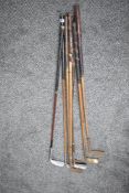 Five vintage Hickory shafted Golf Clubs along with three later Golf Irons, naming difficult to see