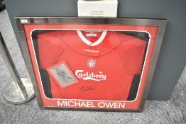 A Liverpool FC Carlsberg Football Shirt bearing signature from Michael Owen, framed, glazed and
