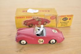 A Dinky Die-cast, 107 Sunbeam Alpine Sports, deep pink with grey interior, driver present, No 34
