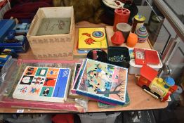 A collection of Childrens vintage Games and Toys including Galt Jigsaws Bonfire, Riding and Skating,