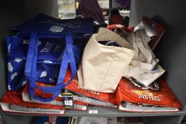 A shelf containing eight Doctor Who DVD Files, all full, along with eight reusable bags/bin