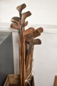 A collection of Hickory Shafted vintage Golf Clubs comprising of four Woods and eleven various Irons