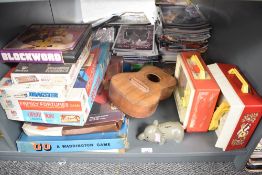 A shelf of vintage Games & Toys including Waddingtons Go and Blockword, Etch A Sketch, Parker Care