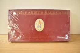 A reproduction limited edition Peter Rabbit Race Game, unopened in original cellophane wrapper,