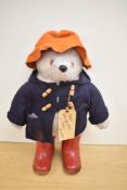 A Gabrielle 1972 Paddington Bear with Darkest Peru Label and wearing orange hat, blue jacket and red