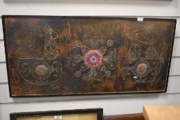 20th Century, a decorative, embossed copper panel inset with enamelled roundels, signature to the