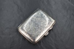 A George V silver cigarette case of hinged rectangular form slightly curved for the gentleman's