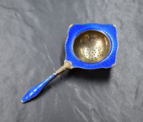A 20th century Norwegian sterling tea strainer, having blue guilloche enamel, marks for Kristian