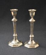 A pair of Elizabeth II silver candlesticks, of turned octagonal form having octagonal scones, raised